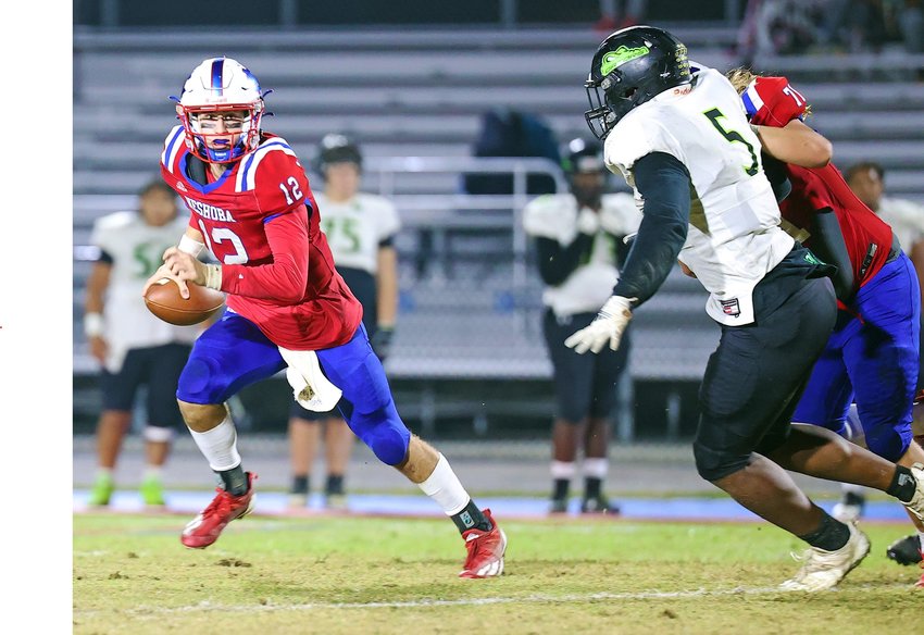 Neshoba Central quarterback Eli Anderson rolls out of the pocket to find a receiver during the Rockets’ comeback win last Friday night.